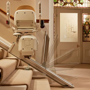 Hinged stairlift rail